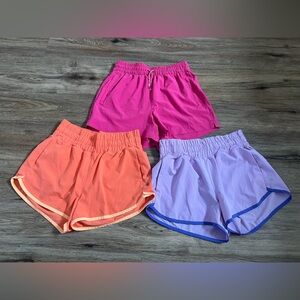 Athleta Girl 3 Pairs of Athletic Shorts Pink, Coral, and Purple Size Large (12)